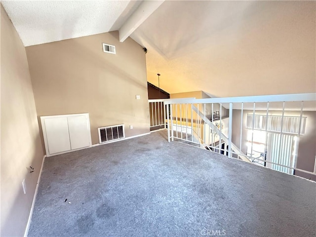 18122 Sundowner Way Unit 1108, Canyon Country, CA 91387 - carpeted empty room with baseboards, beam ceiling, high vaulted ceiling, and a textured ceiling