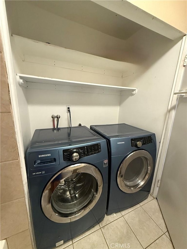 18122 Sundowner Way Unit 1108, Canyon Country, CA 91387 - laundry room with washing machine and clothes dryer and light tile patterned flooring