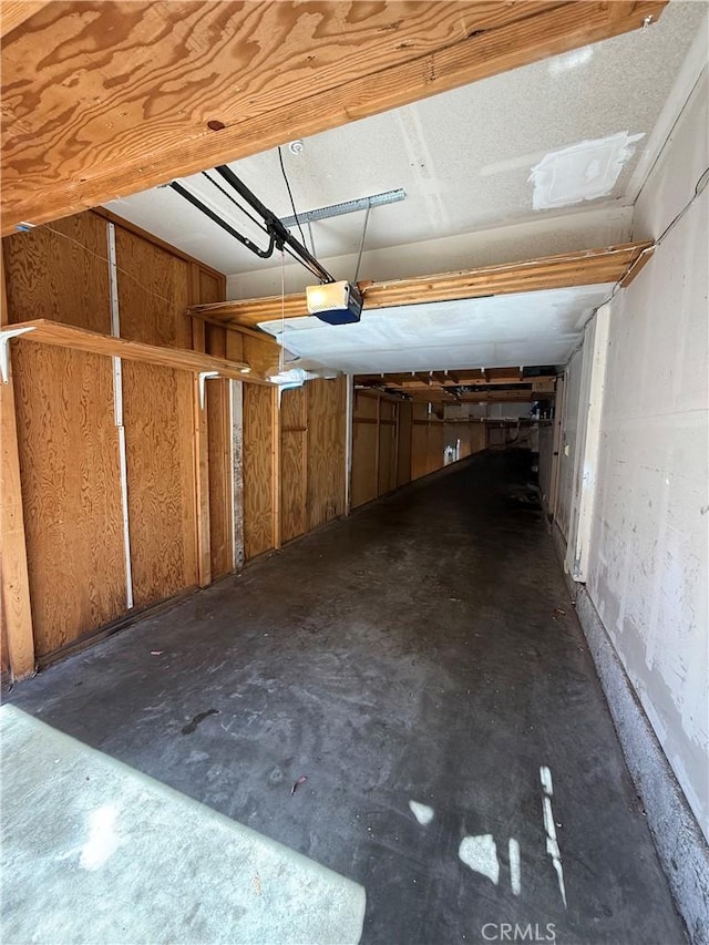 18122 Sundowner Way Unit 1108, Canyon Country, CA 91387 - garage featuring a garage door opener