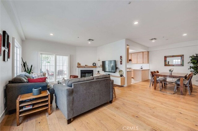 2461 Oneida St Unit B, Pasadena, CA 91107 - living area featuring light wood-type flooring, a glass covered fireplace, and recessed lighting