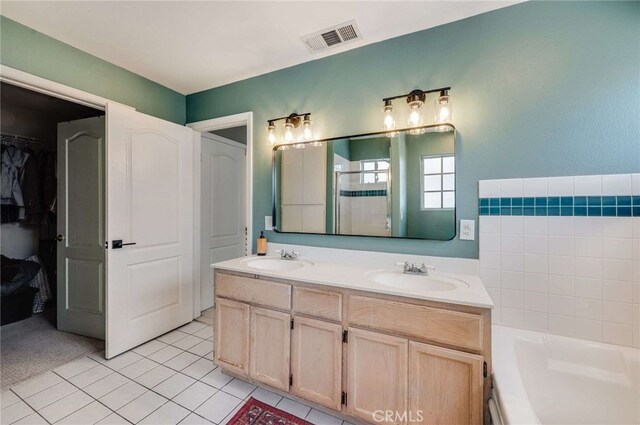 2461 Oneida St Unit B, Pasadena, CA 91107 - full bathroom with double vanity, tile patterned flooring, a bath, a shower, and a walk in closet