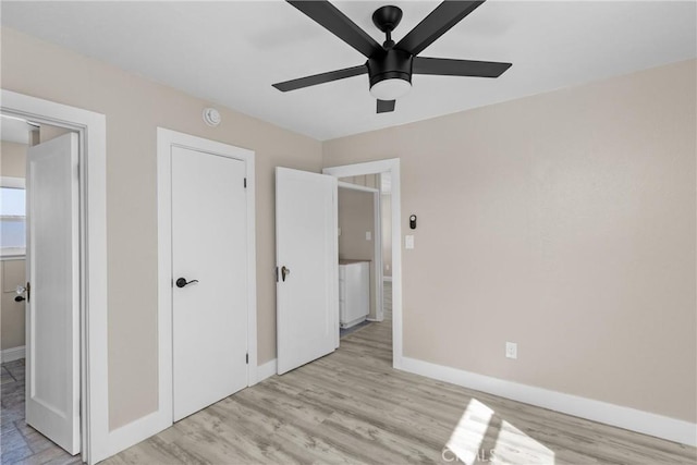 540 Avalon St, Morro Bay, CA 93442 - unfurnished bedroom featuring baseboards, light wood finished floors, and a ceiling fan