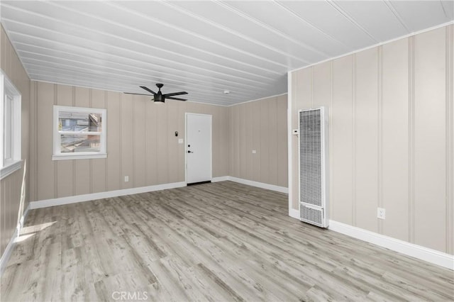540 Avalon St, Morro Bay, CA 93442 - unfurnished living room with a heating unit, wood finished floors, a ceiling fan, and baseboards