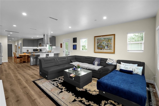424 E Angeleno Ave, San Gabriel, CA 91776 - living room featuring light wood-style floors, recessed lighting, and baseboards