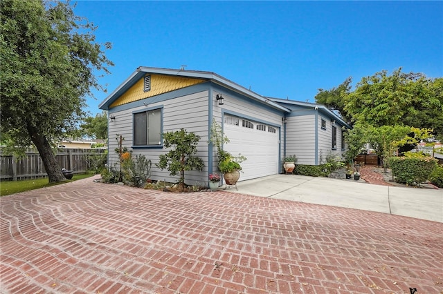 424 E Angeleno Ave, San Gabriel, CA 91776 - view of property exterior featuring concrete driveway, fence, and an attached garage