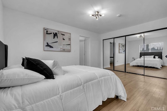 bedroom with wood finished floors