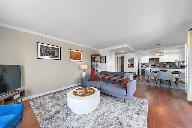 living room with dark wood-type flooring, baseboards, and ornamental molding