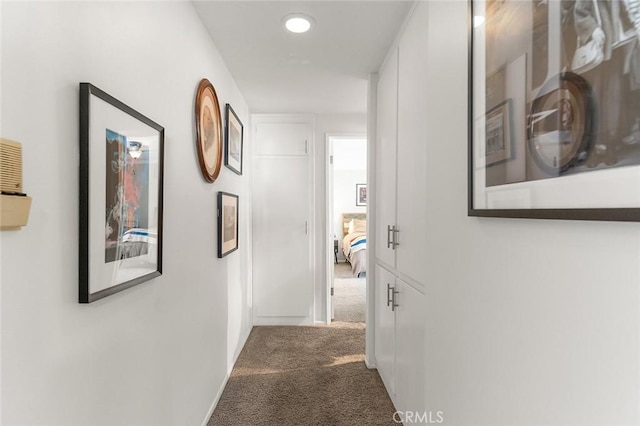 hall featuring carpet, recessed lighting, and baseboards