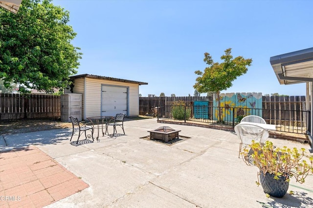1037 Cortina Ct, Orland, CA 95963 - fenced backyard featuring a fire pit, an outbuilding, and a patio