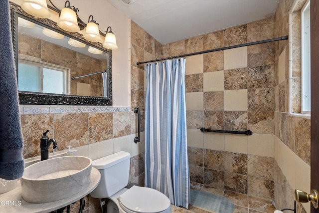 1037 Cortina Ct, Orland, CA 95963 - bathroom with tile walls, toilet, and a tile shower