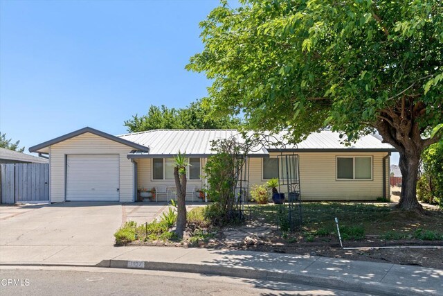 1037 Cortina Ct, Orland, CA 95963 - ranch-style home featuring driveway, an attached garage, and metal roof