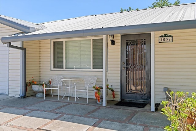 1037 Cortina Ct, Orland, CA 95963 - property entrance with a porch and metal roof