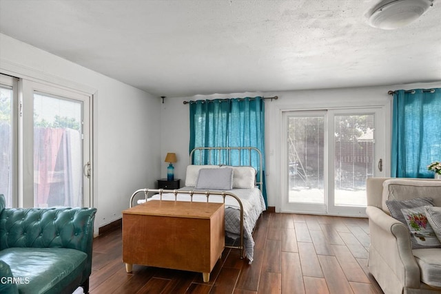 1037 Cortina Ct, Orland, CA 95963 - bedroom with access to outside and wood finished floors