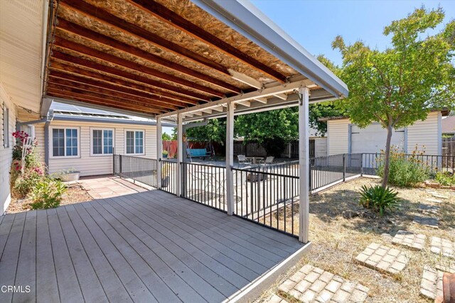1037 Cortina Ct, Orland, CA 95963 - wooden deck with a fenced backyard and a patio