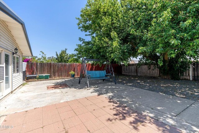 1037 Cortina Ct, Orland, CA 95963 - fenced backyard with a patio area