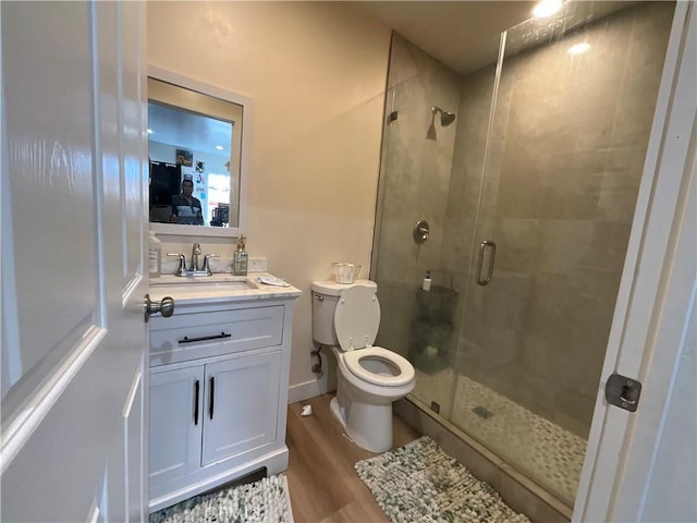 4320 Rio Hondo Ave, Rosemead, CA 91770 - bathroom featuring toilet, a stall shower, wood finished floors, and vanity
