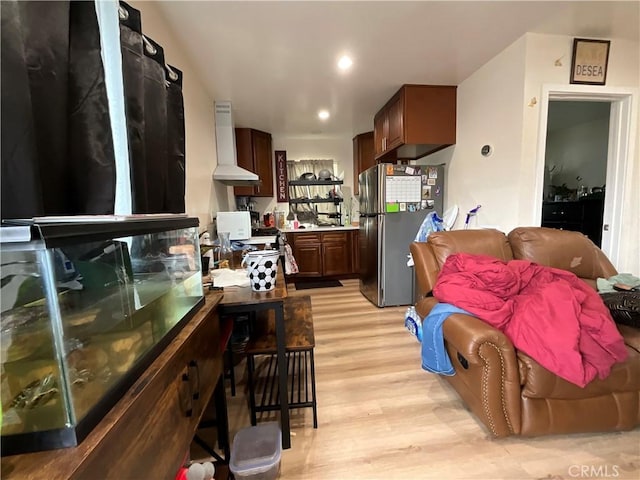 4320 Rio Hondo Ave, Rosemead, CA 91770 - kitchen with appliances with stainless steel finishes, wall chimney exhaust hood, light wood-style floors, recessed lighting, and dark brown cabinetry