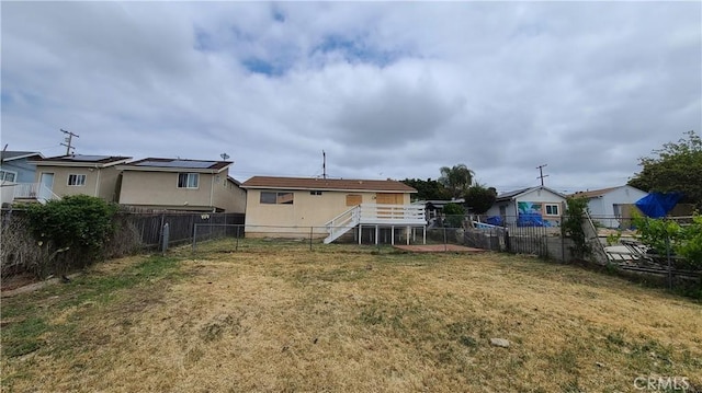 back of property with stairway
