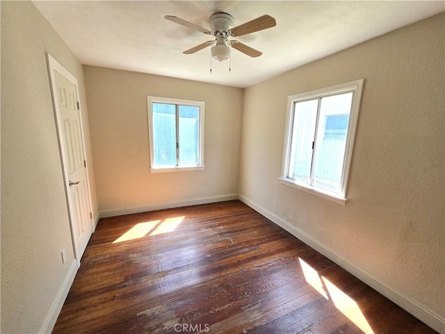 621 Colusa St, Orland, CA 95963 - unfurnished room with dark wood-style floors, baseboards, and ceiling fan