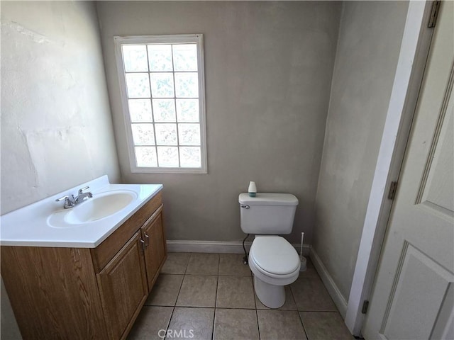 621 Colusa St, Orland, CA 95963 - bathroom featuring toilet, vanity, healthy amount of natural light, and tile patterned flooring