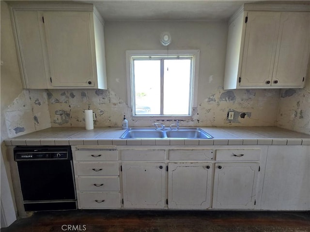 621 Colusa St, Orland, CA 95963 - kitchen with dishwasher, a sink, white cabinetry, and decorative backsplash