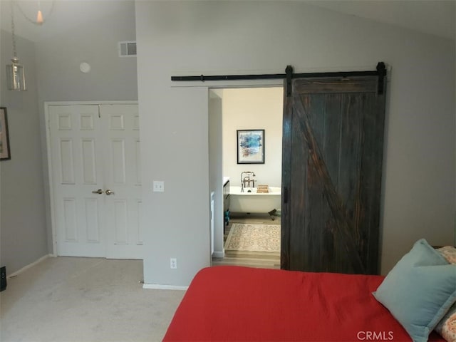 22000 Jodi Pl, Saugus, CA 91350 - carpeted bedroom featuring a barn door and baseboards