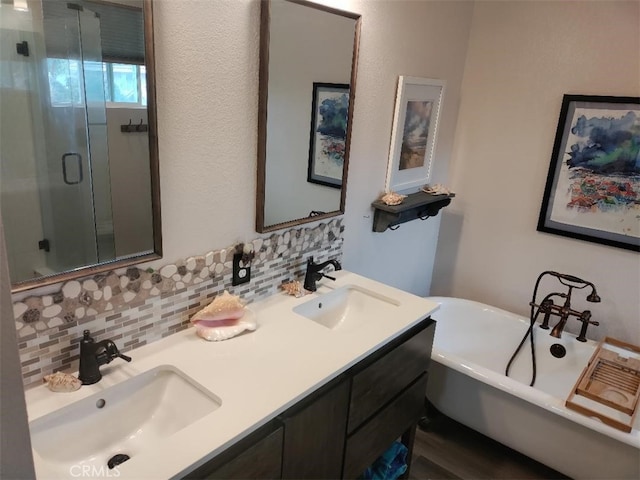 22000 Jodi Pl, Saugus, CA 91350 - bathroom featuring tasteful backsplash, a stall shower, a freestanding bath, double vanity, and wood finished floors