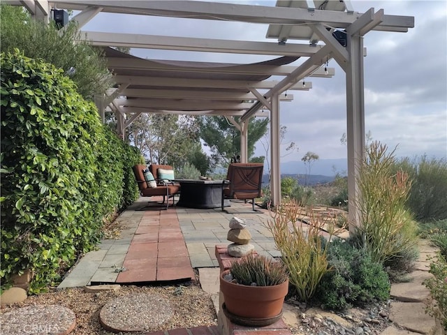 22000 Jodi Pl, Saugus, CA 91350 - view of patio / terrace with an outdoor fire pit and a pergola