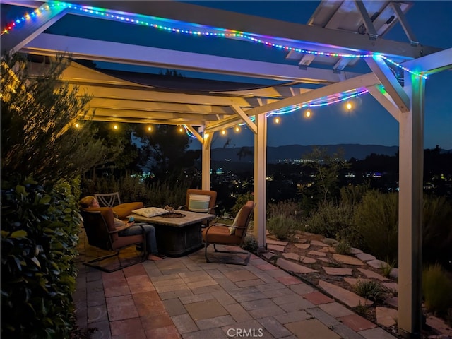 22000 Jodi Pl, Saugus, CA 91350 - patio at twilight with a fire pit, a patio, and a pergola