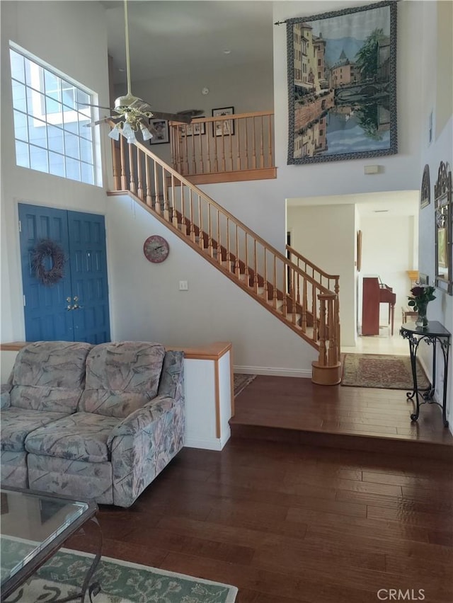 22000 Jodi Pl, Saugus, CA 91350 - living room with a high ceiling, hardwood / wood-style flooring, stairway, and ceiling fan