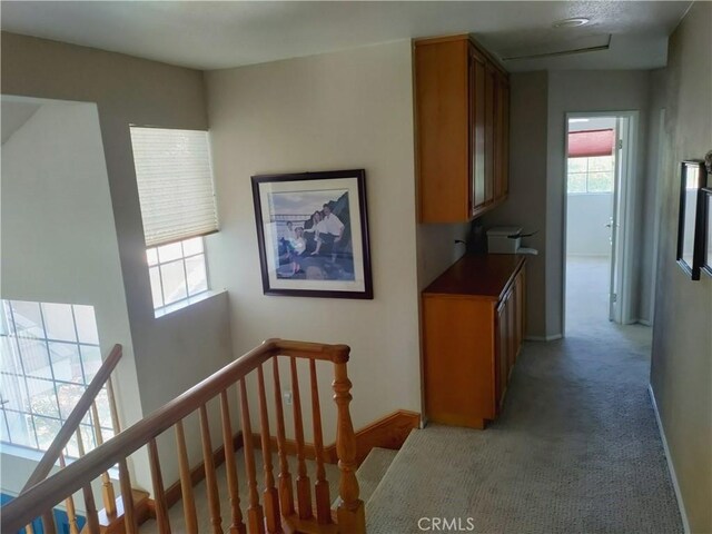 22000 Jodi Pl, Saugus, CA 91350 - hallway featuring an upstairs landing and light carpet