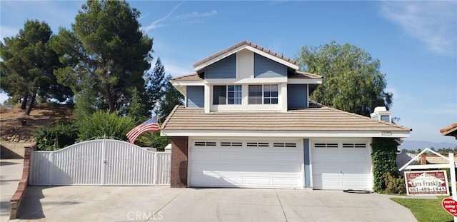 22000 Jodi Pl, Saugus, CA 91350 - view of front of property featuring a gate, driveway, a tile roof, and an attached garage