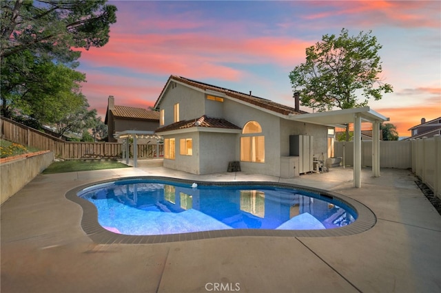 39812 Barcelona, Murrieta, CA 92562 - pool at dusk with a patio and a fenced backyard