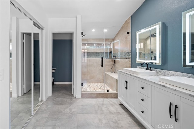 39812 Barcelona, Murrieta, CA 92562 - full bath featuring a stall shower, double vanity, and toilet
