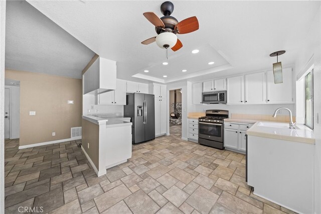 39812 Barcelona, Murrieta, CA 92562 - kitchen featuring appliances with stainless steel finishes, a sink, light stone finish floors, ceiling fan, and recessed lighting