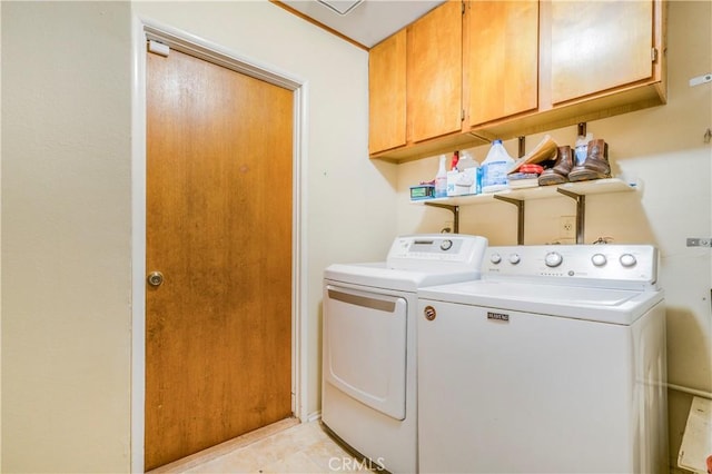 23867 Gamma St, Moreno Valley, CA 92553 - laundry area featuring washer and dryer, cabinet space, and light tile patterned floors