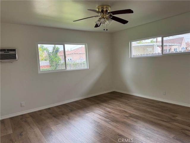241 N 16th St N, Montebello, CA 90640 - unfurnished room with a wall mounted air conditioner, wood finished floors, and baseboards