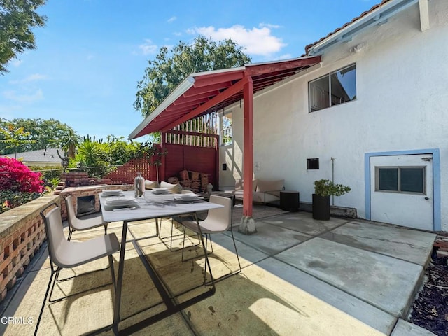 view of patio / terrace featuring outdoor dining area and fence