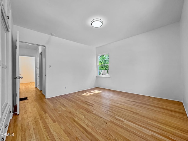 unfurnished bedroom with light wood finished floors