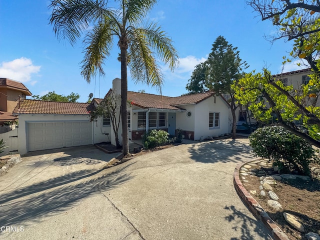 2708 Sanborn Ave, La Crescenta, CA 91214 - view of front of house with concrete driveway, a tiled roof, stucco siding, and a garage
