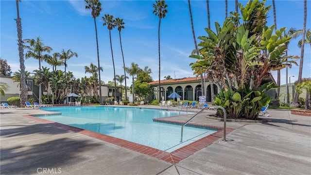 community pool with a patio area