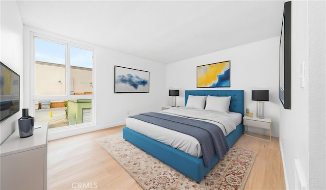 bedroom with wood finished floors