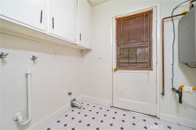 6329 Fillmore Ave, Rialto, CA 92377 - laundry room featuring cabinet space, baseboards, and light flooring