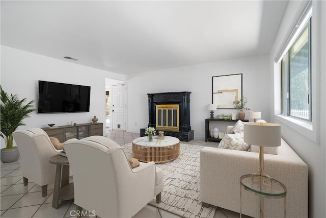 living room with light tile patterned flooring and a premium fireplace