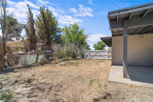 view of yard with fence and a patio area