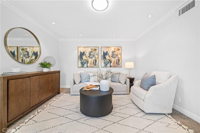 living room featuring baseboards, ornamental molding, and recessed lighting