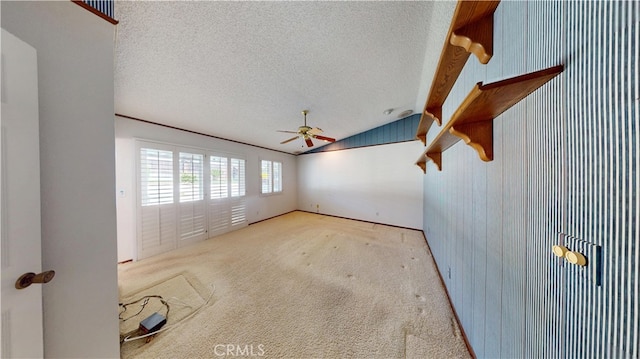 279 White Oak Rd, Lake Elsinore, CA 92530 - spare room featuring vaulted ceiling, a textured ceiling, ceiling fan, and carpet