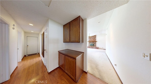 279 White Oak Rd, Lake Elsinore, CA 92530 - hall featuring light wood-type flooring, recessed lighting, a textured ceiling, and baseboards
