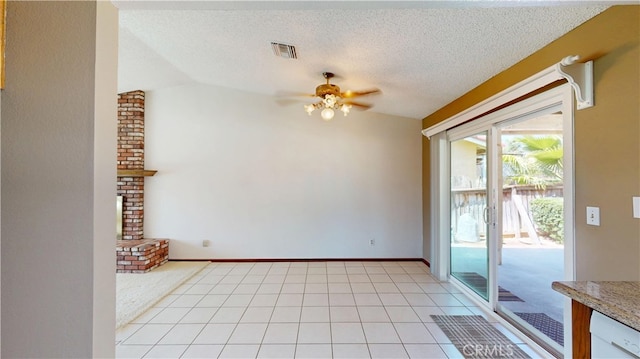 279 White Oak Rd, Lake Elsinore, CA 92530 - spare room with a ceiling fan, a textured ceiling, vaulted ceiling, and baseboards
