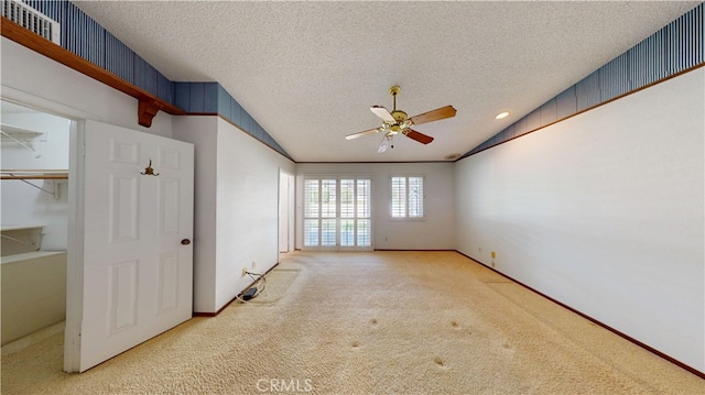 279 White Oak Rd, Lake Elsinore, CA 92530 - carpeted spare room featuring lofted ceiling, a ceiling fan, a textured ceiling, and baseboards